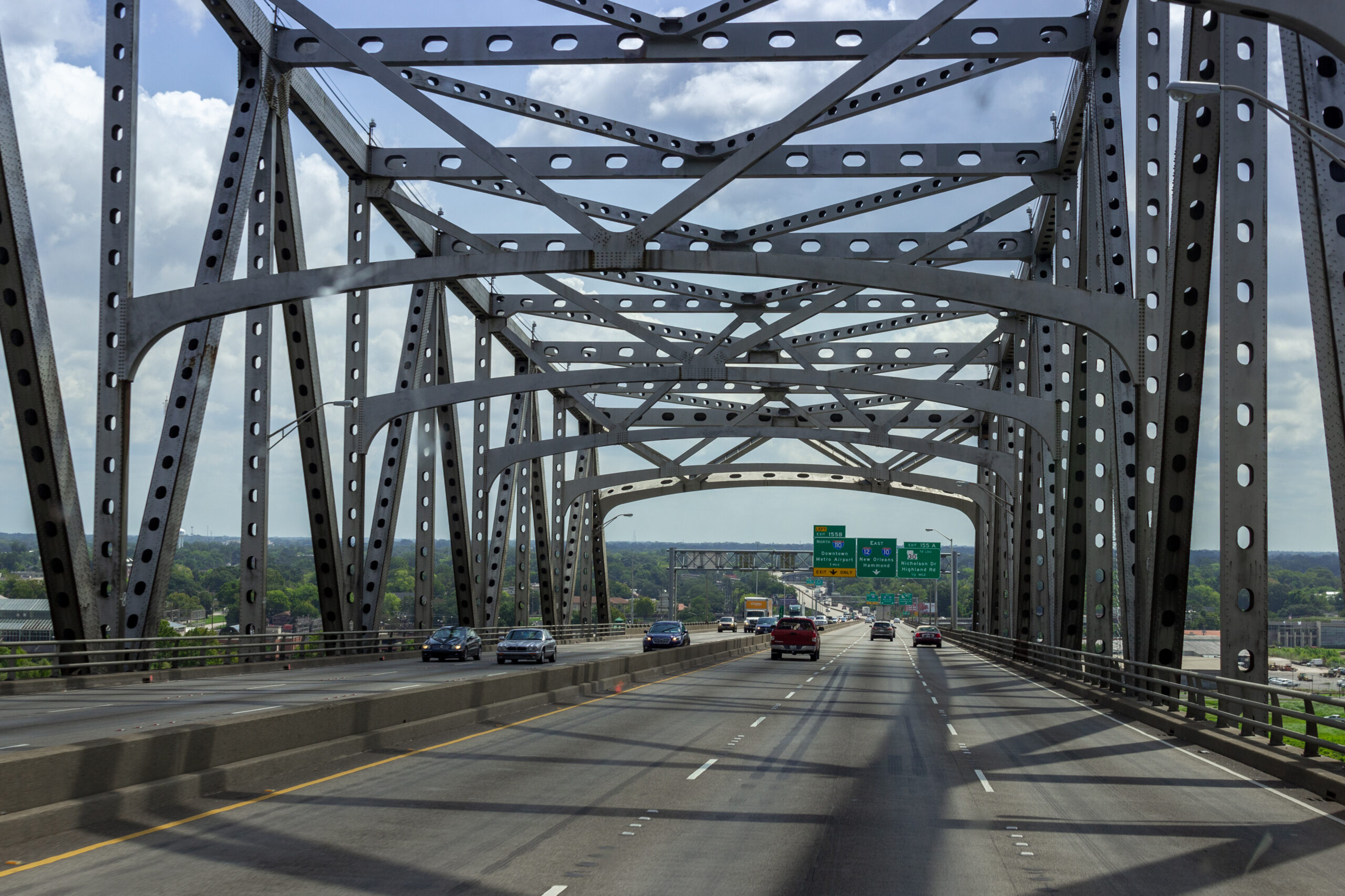 20 August, 2018/ Baton Rouge, Mississippi River Horace Wilkinson Bridge, Louisiana, USA/ Cars passing on a large high bridge on the river.